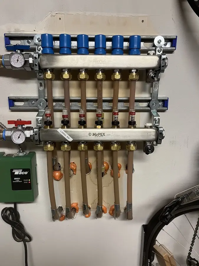 Plumber performing Water Heater Repair at a residential property in Westwood